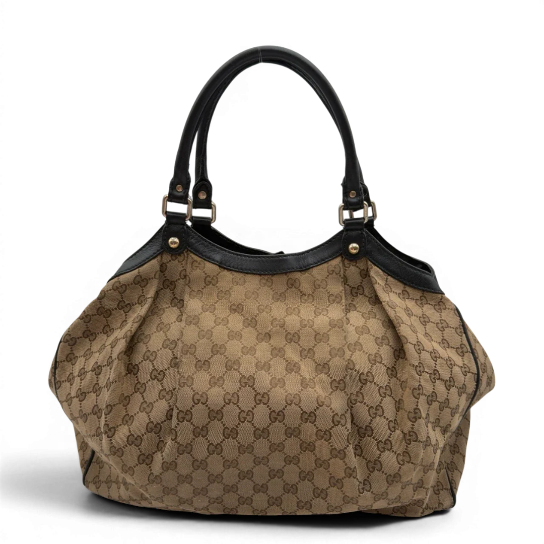 https://cdn.shopify.com/s/files/1/0564/9376/8855/files/Gucci_Shopper_Sukey_large_monogram_beige_1_e68f8f58-7400-4b05-9583-c5cb1886954b.webp?v=1784240823