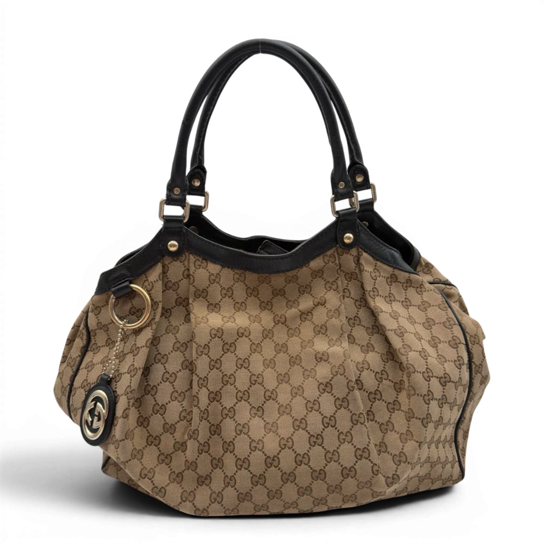 https://cdn.shopify.com/s/files/1/0564/9376/8855/files/Gucci_Shopper_Sukey_large_monogram_beige_2_d998f3d8-5f8d-4918-b8f5-61111e9533bf.webp?v=1784240823