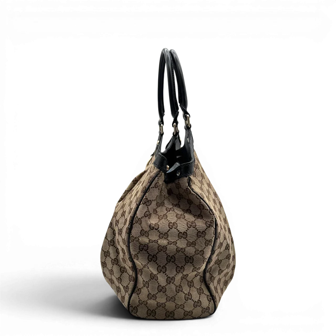 https://cdn.shopify.com/s/files/1/0564/9376/8855/files/Gucci_Shopper_Sukey_large_monogram_beige_3.webp?v=1781106234