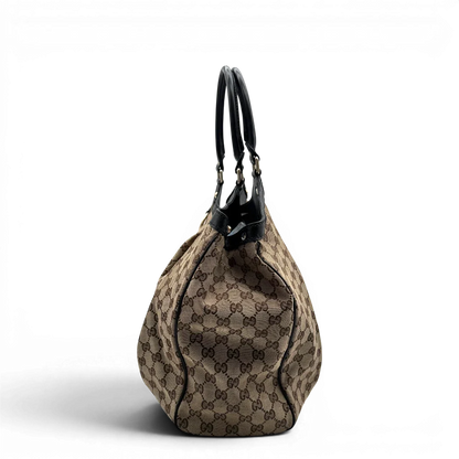https://cdn.shopify.com/s/files/1/0564/9376/8855/files/Gucci_Shopper_Sukey_large_monogram_beige_3.webp?v=1781106234