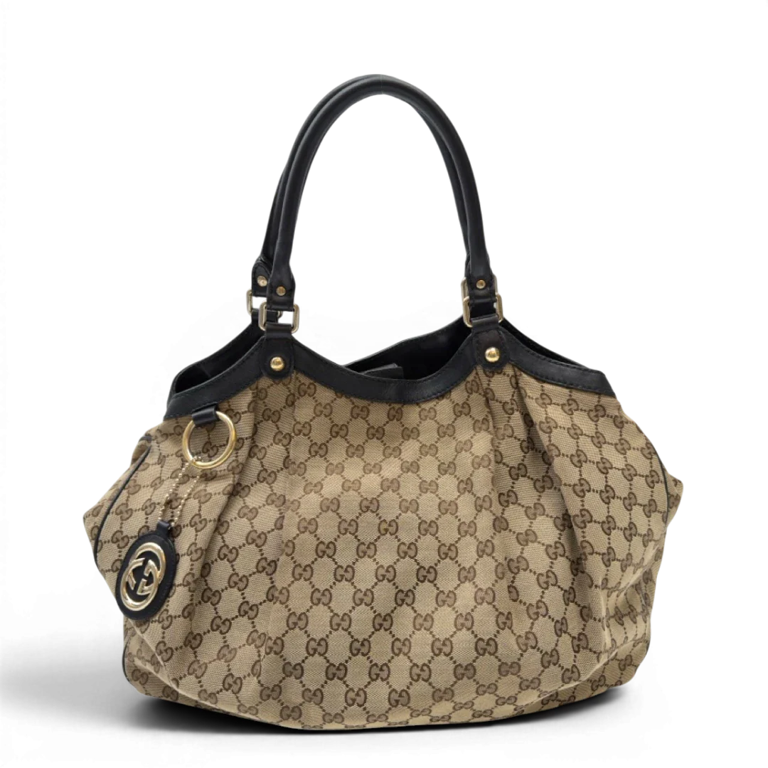 https://cdn.shopify.com/s/files/1/0564/9376/8855/files/Gucci_Shopper_Sukey_large_monogram_beige_3_55ec0cae-b8eb-4cda-b14d-bb0bc236d844.webp?v=1783515047