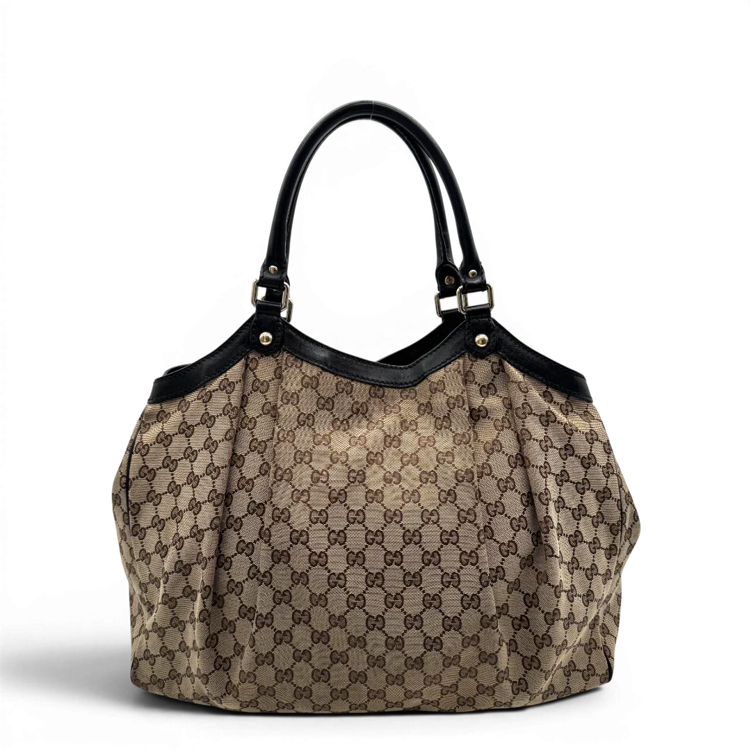 https://cdn.shopify.com/s/files/1/0564/9376/8855/files/Gucci_Shopper_Sukey_large_monogram_beige_4.webp?v=1781106234