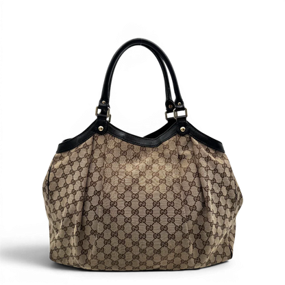 https://cdn.shopify.com/s/files/1/0564/9376/8855/files/Gucci_Shopper_Sukey_large_monogram_beige_4.webp?v=1781106234