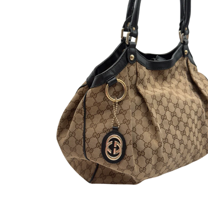 https://cdn.shopify.com/s/files/1/0564/9376/8855/files/Gucci_Shopper_Sukey_large_monogram_beige_7_7810b2de-4483-41e4-9a7e-3c1571afc439.webp?v=1784240823