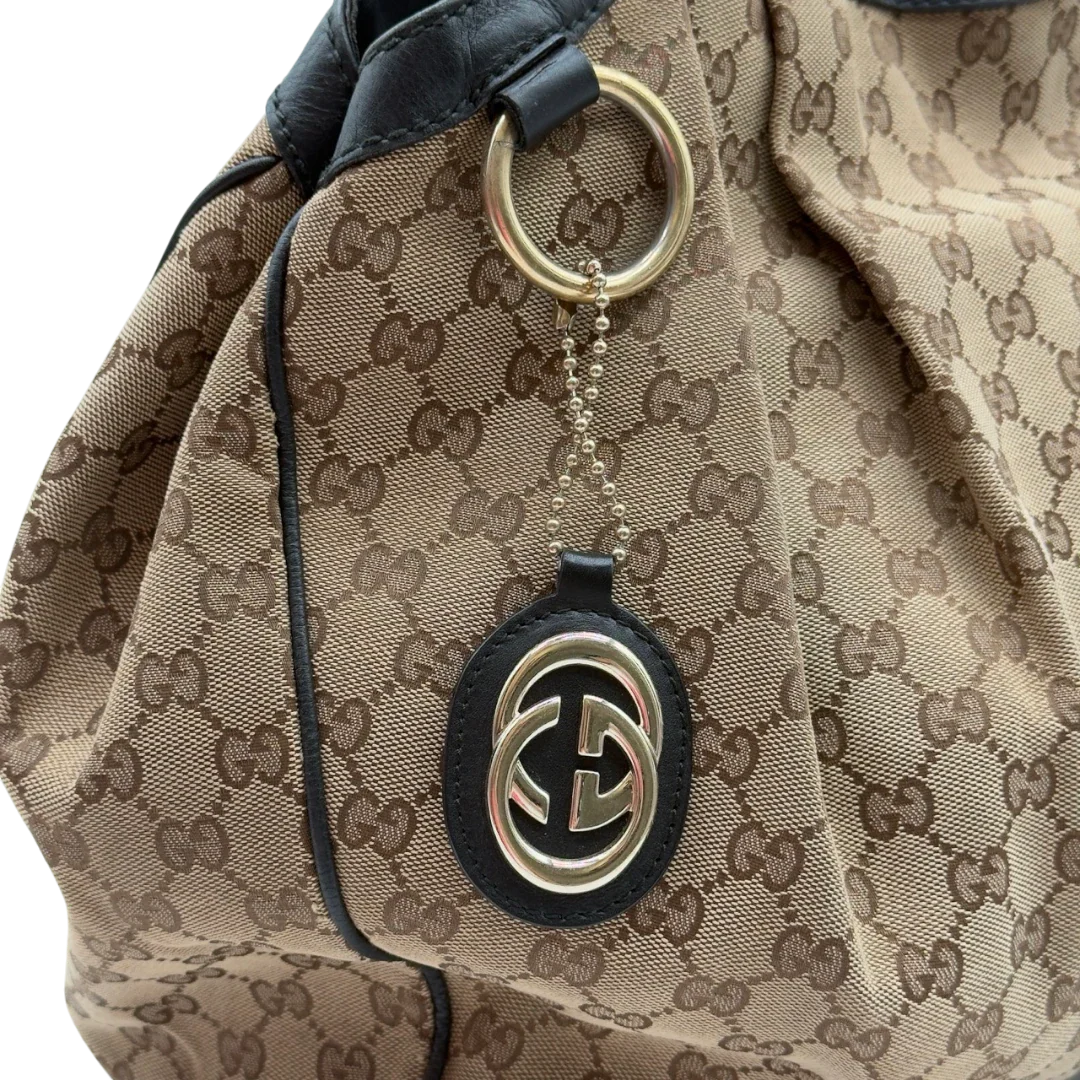 https://cdn.shopify.com/s/files/1/0564/9376/8855/files/Gucci_Shopper_Sukey_large_monogram_beige_9_c010f2c0-fd6b-4a0d-aa06-b162e1f7348a.webp?v=1784240823
