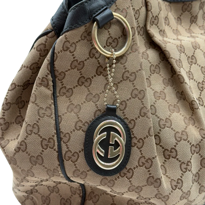 https://cdn.shopify.com/s/files/1/0564/9376/8855/files/Gucci_Shopper_Sukey_large_monogram_beige_9_c010f2c0-fd6b-4a0d-aa06-b162e1f7348a.webp?v=1784240823