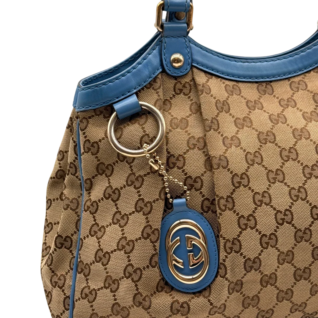 https://cdn.shopify.com/s/files/1/0564/9376/8855/files/Gucci_Shopper_Sukey_monogram_beige_11_418223f7-4bd2-45ad-a99b-c5e853af0a1a.webp?v=1784801539
