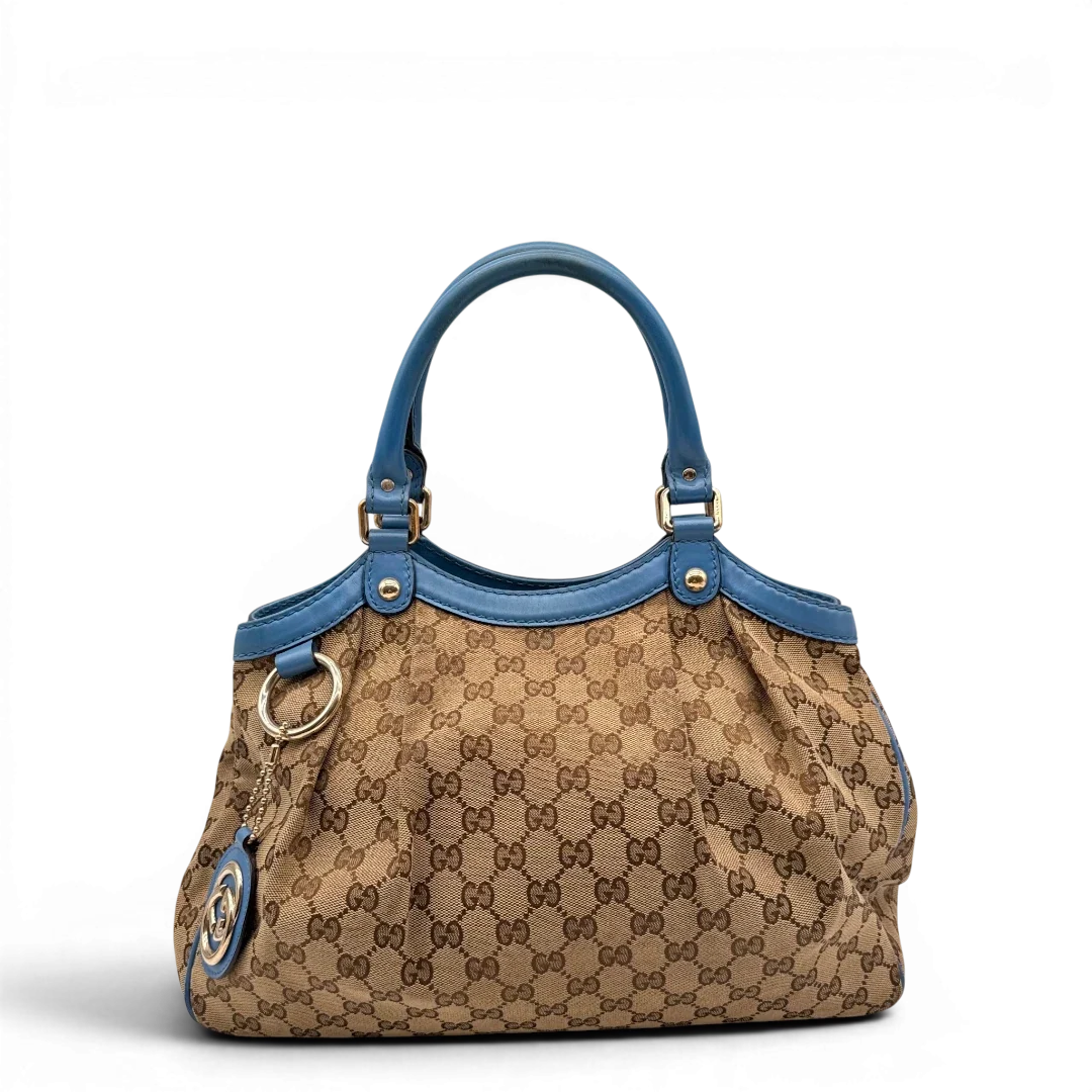 https://cdn.shopify.com/s/files/1/0564/9376/8855/files/Gucci_Shopper_Sukey_monogram_beige_1_a96f6261-6460-448d-be8b-36e1c2e8817a.webp?v=1784801539