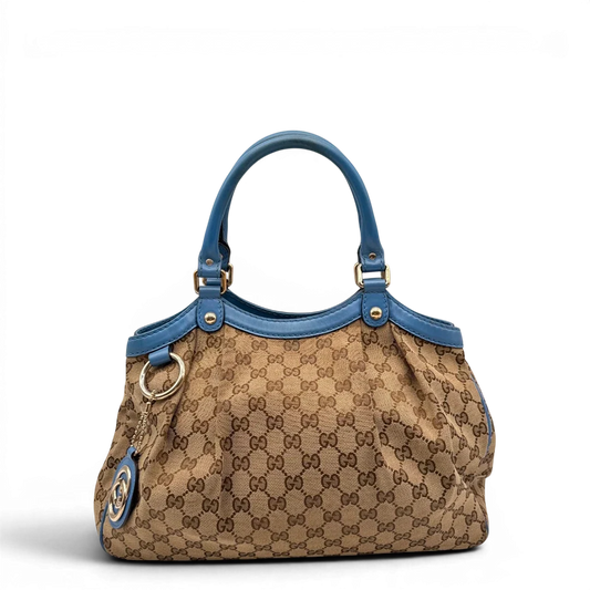 https://cdn.shopify.com/s/files/1/0564/9376/8855/files/Gucci_Shopper_Sukey_monogram_beige_1_a96f6261-6460-448d-be8b-36e1c2e8817a.webp?v=1784801539