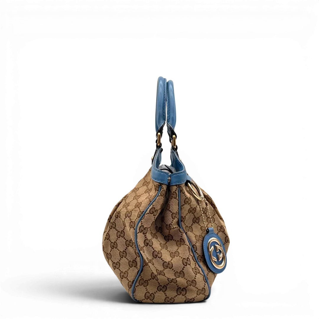 https://cdn.shopify.com/s/files/1/0564/9376/8855/files/Gucci_Shopper_Sukey_monogram_beige_3_40d7f487-5121-40cc-8057-90da313946bd.webp?v=1784801538