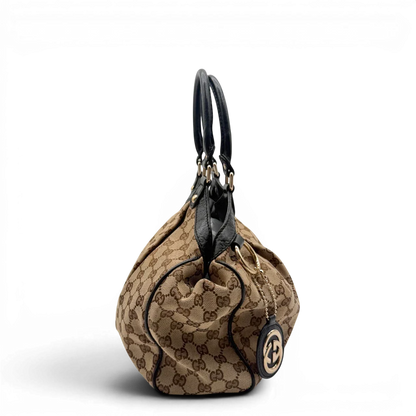https://cdn.shopify.com/s/files/1/0564/9376/8855/files/Gucci_Shopper_Sukey_monogram_beige_4.webp?v=1782310480