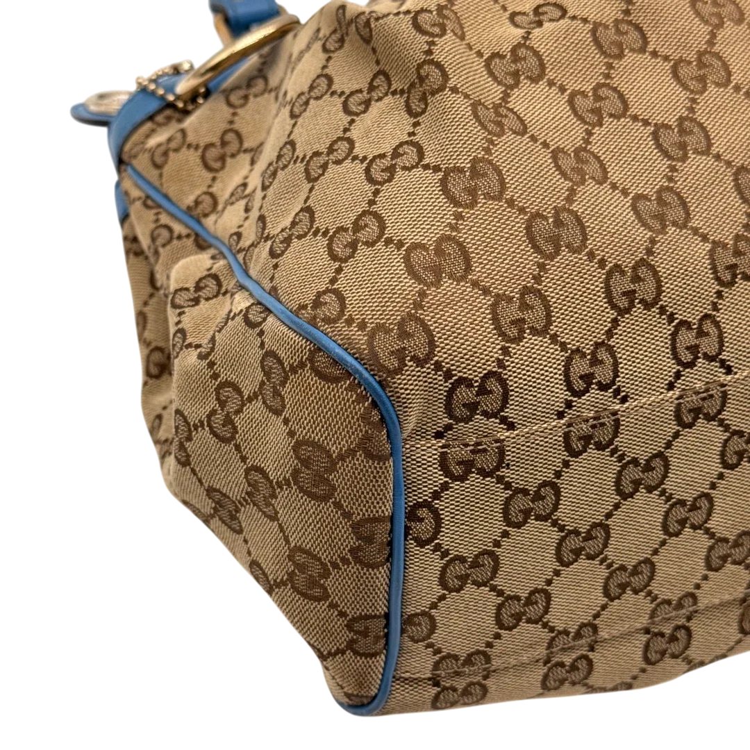https://cdn.shopify.com/s/files/1/0564/9376/8855/files/Gucci_Shopper_Sukey_monogram_beige_7_ff44c818-2cf1-47f7-a7ab-63957294eff7.webp?v=1784801539
