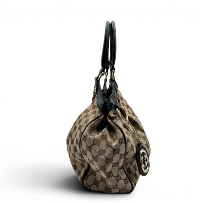https://cdn.shopify.com/s/files/1/0564/9376/8855/files/Gucci_Shopper_Sukey_monogram_beige_vintage_GG1688.webp?v=1779407955