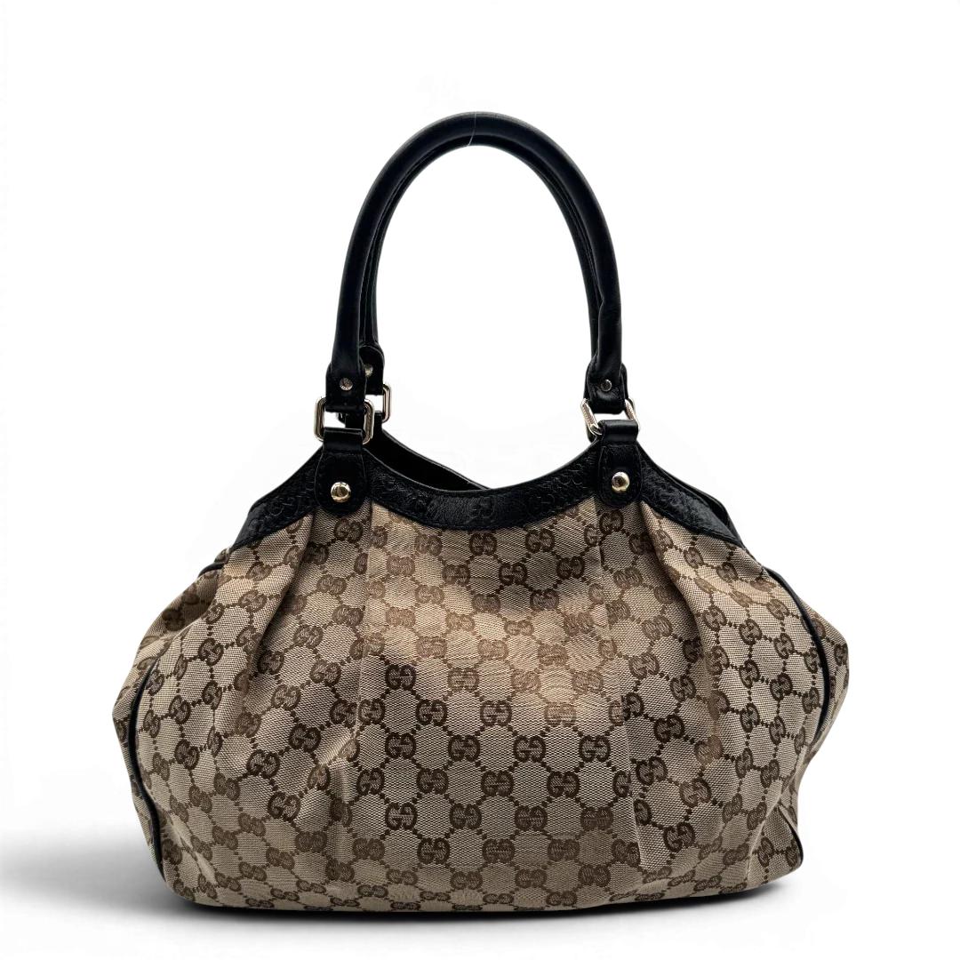 https://cdn.shopify.com/s/files/1/0564/9376/8855/files/Gucci_Shopper_Sukey_monogram_beige_vintage_GG1691.webp?v=1779407955