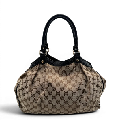 https://cdn.shopify.com/s/files/1/0564/9376/8855/files/Gucci_Shopper_Sukey_monogram_beige_vintage_GG1691.webp?v=1779407955