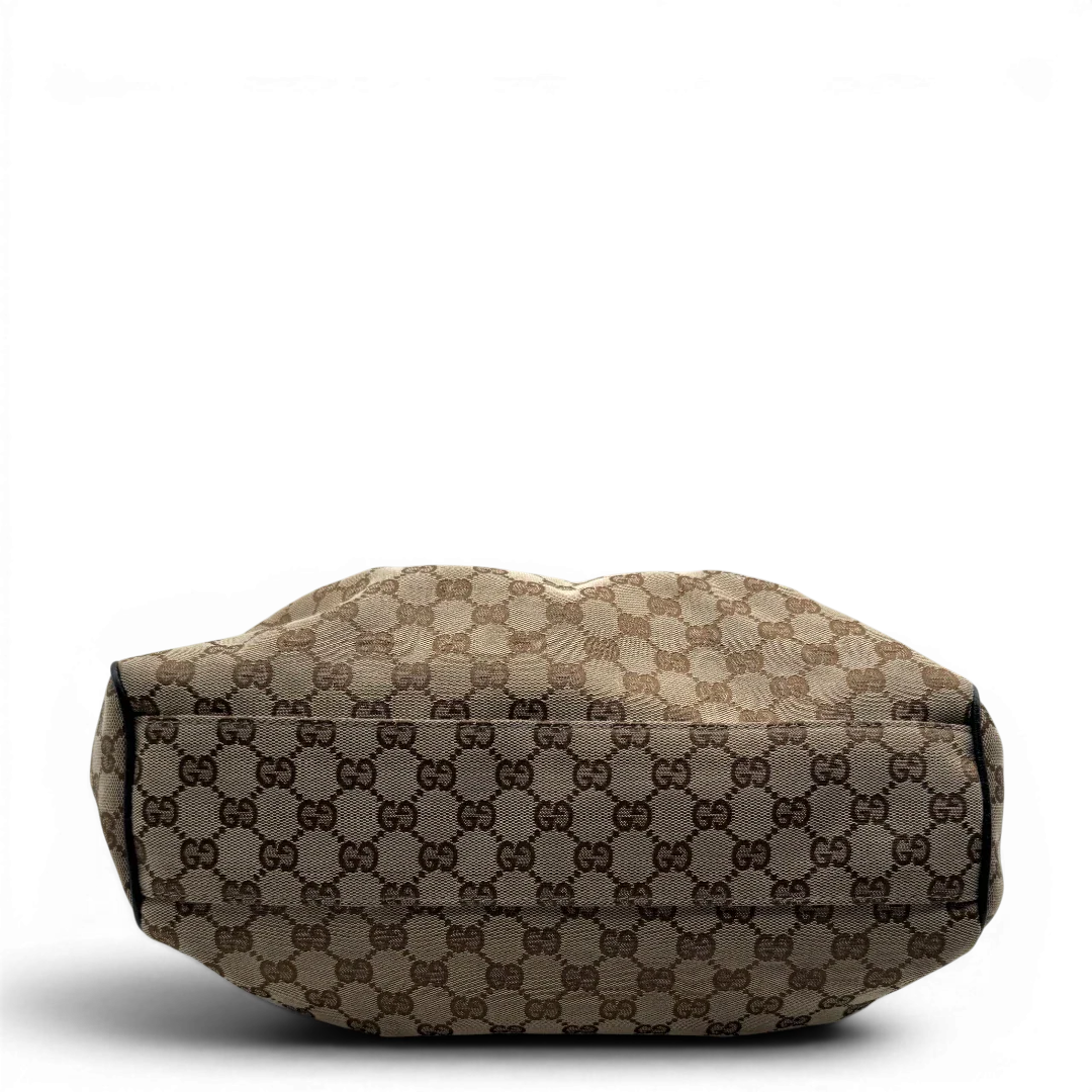 https://cdn.shopify.com/s/files/1/0564/9376/8855/files/Gucci_Shopper_Sukey_monogram_beige_vintage_GG1692.webp?v=1779407955