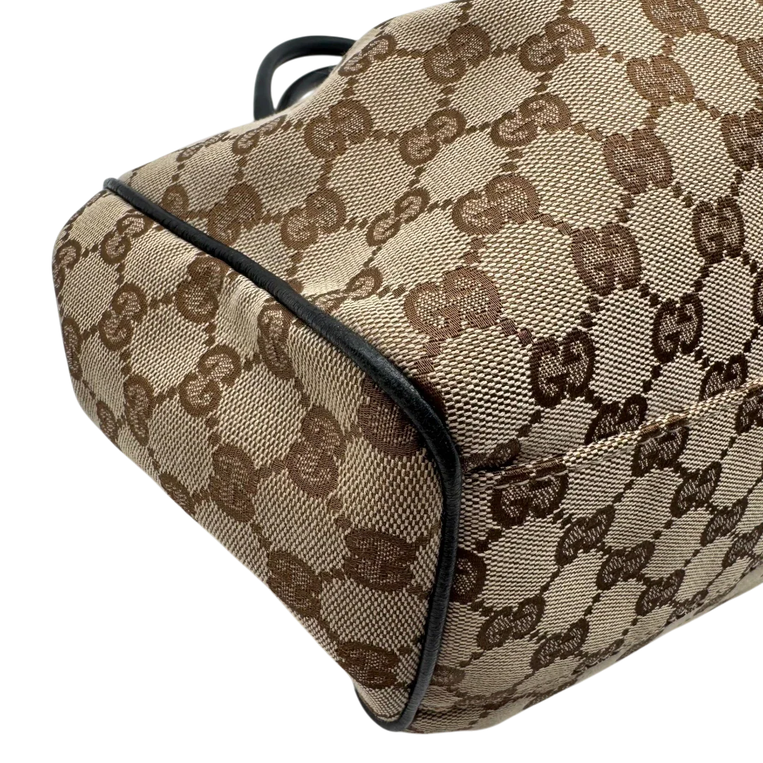 https://cdn.shopify.com/s/files/1/0564/9376/8855/files/Gucci_Shopper_Sukey_monogram_beige_vintage_GG1693.webp?v=1779407956