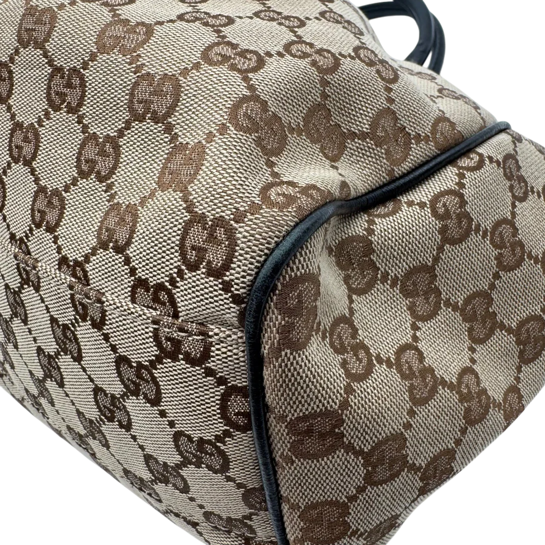 https://cdn.shopify.com/s/files/1/0564/9376/8855/files/Gucci_Shopper_Sukey_monogram_beige_vintage_GG1696.webp?v=1779407956