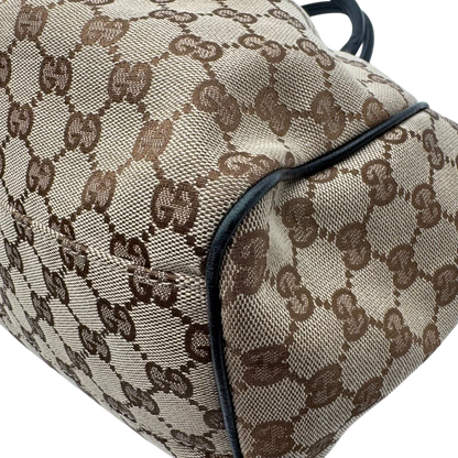 https://cdn.shopify.com/s/files/1/0564/9376/8855/files/Gucci_Shopper_Sukey_monogram_beige_vintage_GG1696.webp?v=1779407956