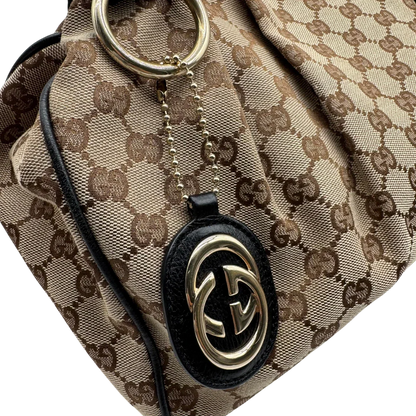 https://cdn.shopify.com/s/files/1/0564/9376/8855/files/Gucci_Shopper_Sukey_monogram_beige_vintage_GG1698.webp?v=1779407956