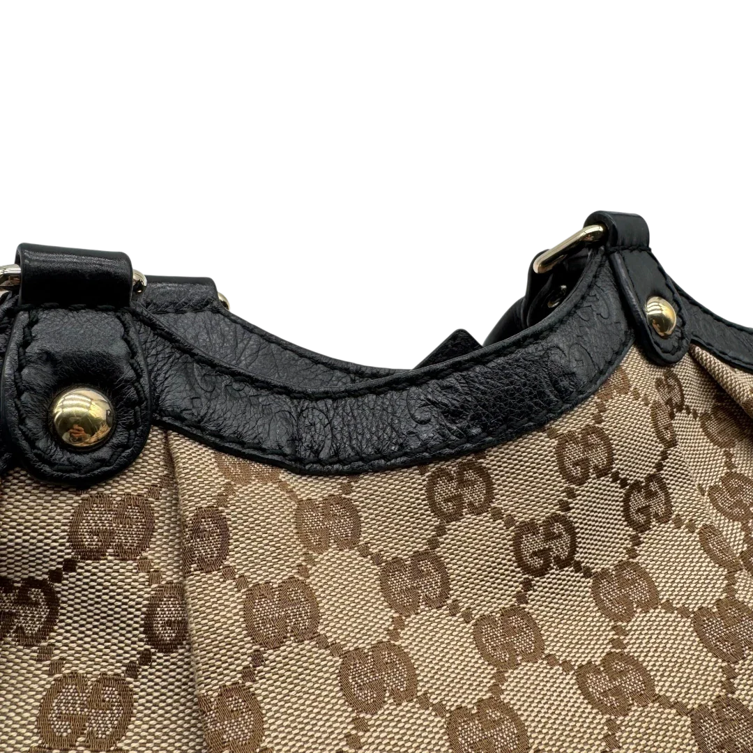 https://cdn.shopify.com/s/files/1/0564/9376/8855/files/Gucci_Shopper_Sukey_monogram_beige_vintage_GG1700.webp?v=1779407956