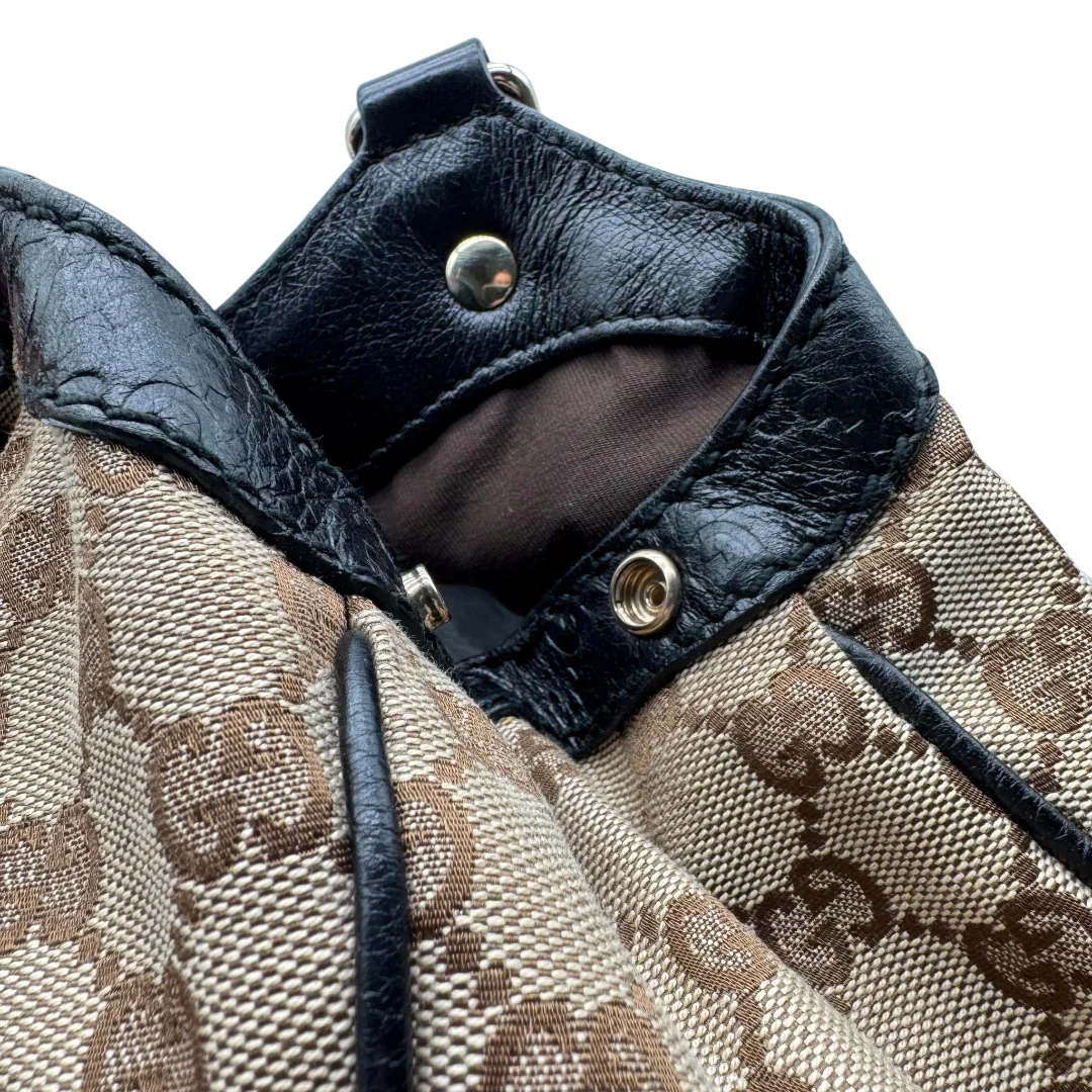 https://cdn.shopify.com/s/files/1/0564/9376/8855/files/Gucci_Shopper_Sukey_monogram_beige_vintage_GG1702.webp?v=1779407956