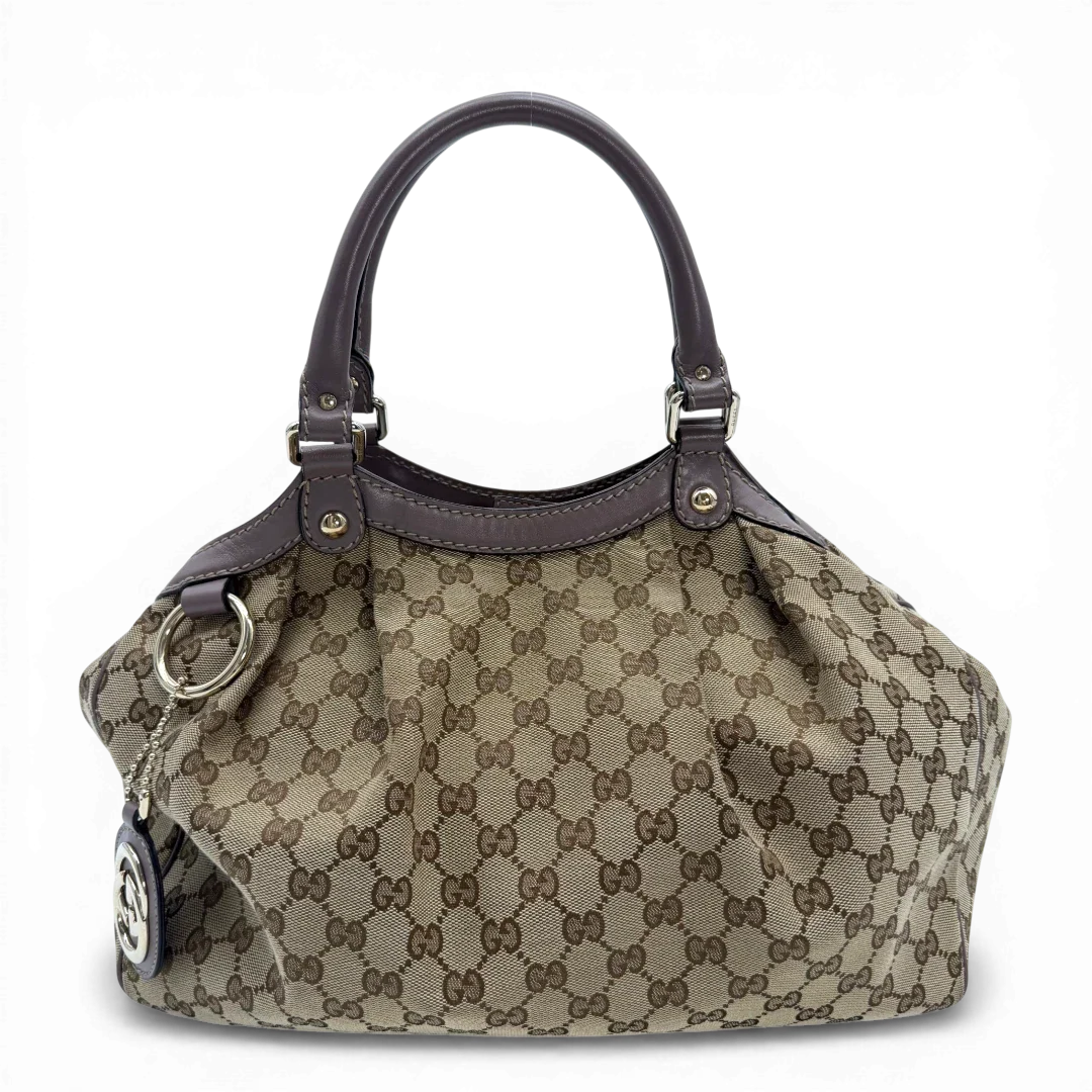 https://cdn.shopify.com/s/files/1/0564/9376/8855/files/Gucci_Shopper_Sukey_monogram_beige_vintage_GG6138.webp?v=1775065175