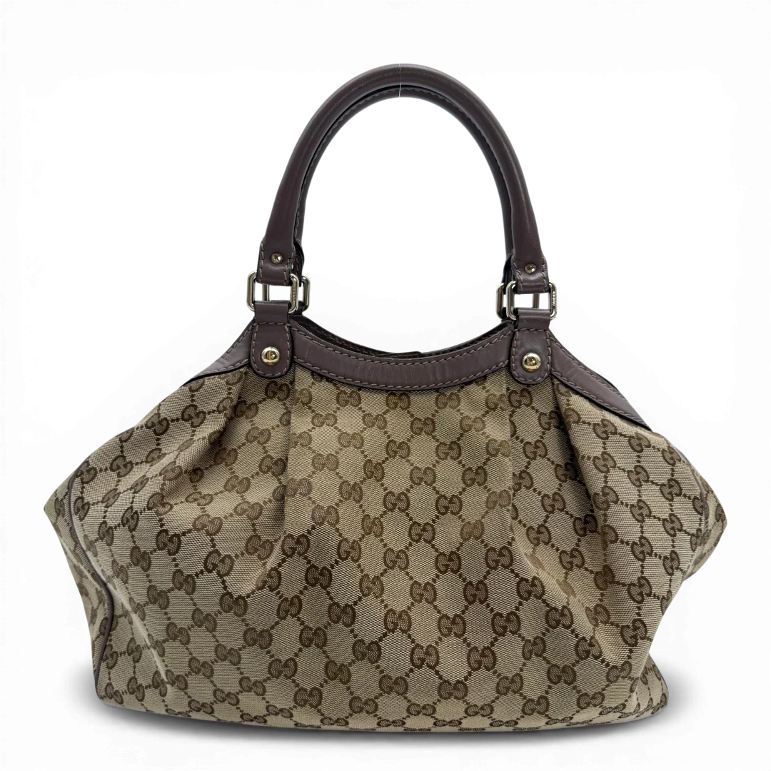 https://cdn.shopify.com/s/files/1/0564/9376/8855/files/Gucci_Shopper_Sukey_monogram_beige_vintage_GG6139.webp?v=1775065193