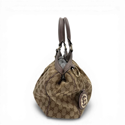 https://cdn.shopify.com/s/files/1/0564/9376/8855/files/Gucci_Shopper_Sukey_monogram_beige_vintage_GG6140.webp?v=1775065193