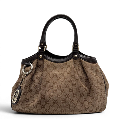 https://cdn.shopify.com/s/files/1/0564/9376/8855/files/Gucci_Shopper_Sukey_monogram_beige_vintage_GG6472.webp?v=1778675338
