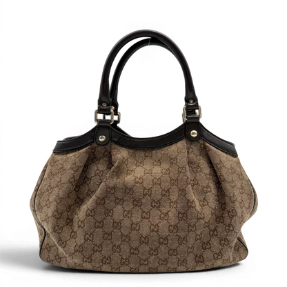 https://cdn.shopify.com/s/files/1/0564/9376/8855/files/Gucci_Shopper_Sukey_monogram_beige_vintage_GG6474.webp?v=1778675337