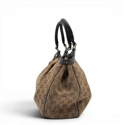 https://cdn.shopify.com/s/files/1/0564/9376/8855/files/Gucci_Shopper_Sukey_monogram_beige_vintage_GG6475.webp?v=1778675338