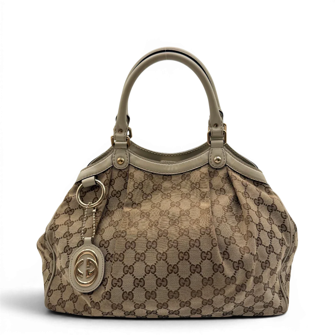 https://cdn.shopify.com/s/files/1/0564/9376/8855/files/Gucci_Shopper_Sukey_monogram_beige_vintage_GG8432.webp?v=1781108879