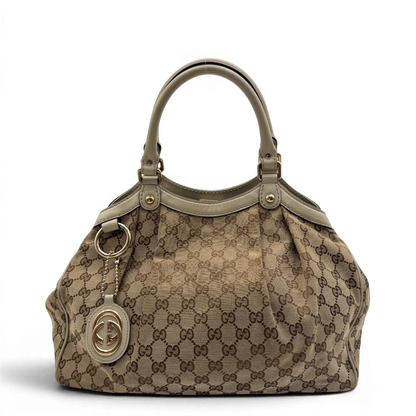 https://cdn.shopify.com/s/files/1/0564/9376/8855/files/Gucci_Shopper_Sukey_monogram_beige_vintage_GG8432.webp?v=1781108879