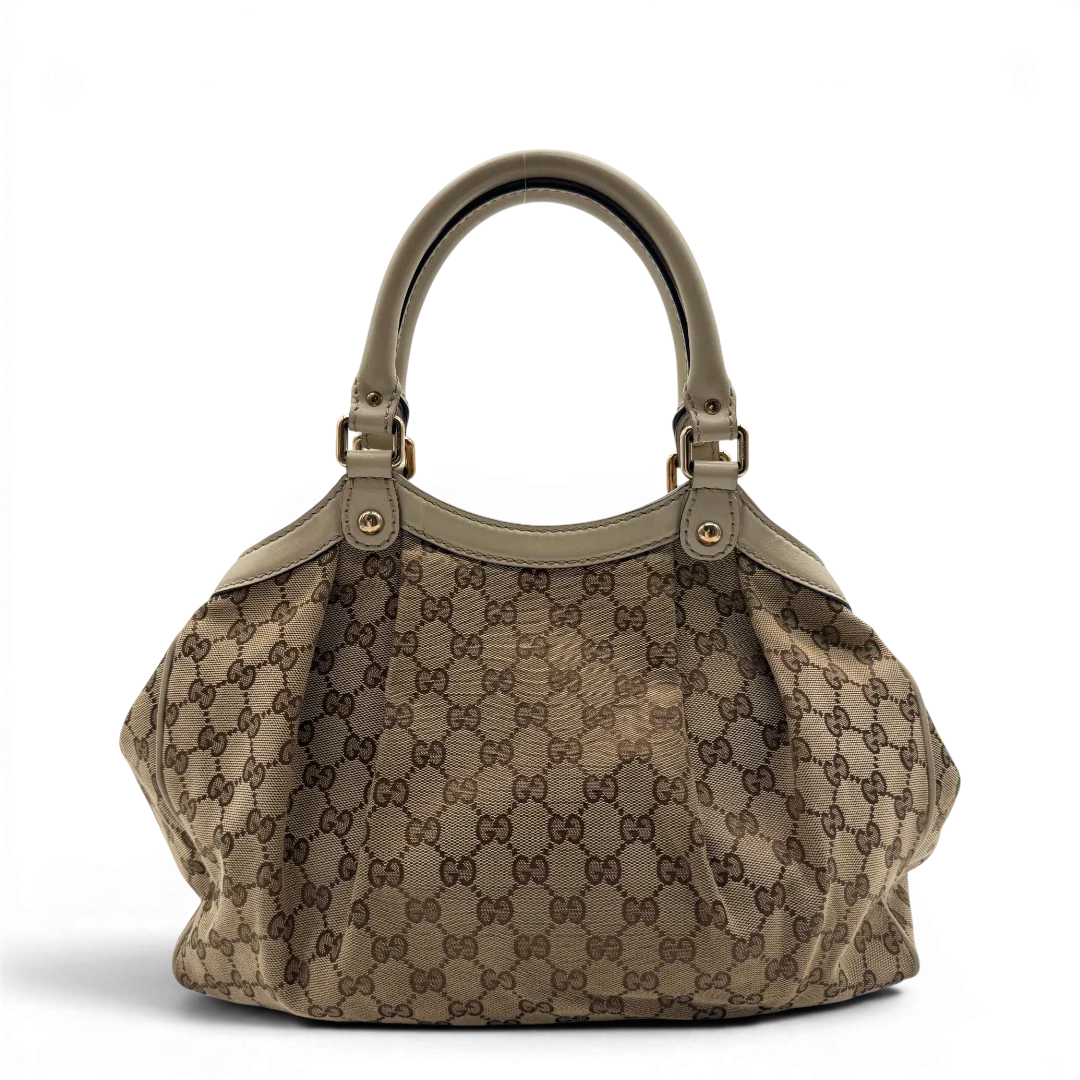 https://cdn.shopify.com/s/files/1/0564/9376/8855/files/Gucci_Shopper_Sukey_monogram_beige_vintage_GG8433.webp?v=1781108879