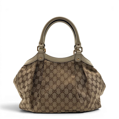 https://cdn.shopify.com/s/files/1/0564/9376/8855/files/Gucci_Shopper_Sukey_monogram_beige_vintage_GG8433.webp?v=1781108879