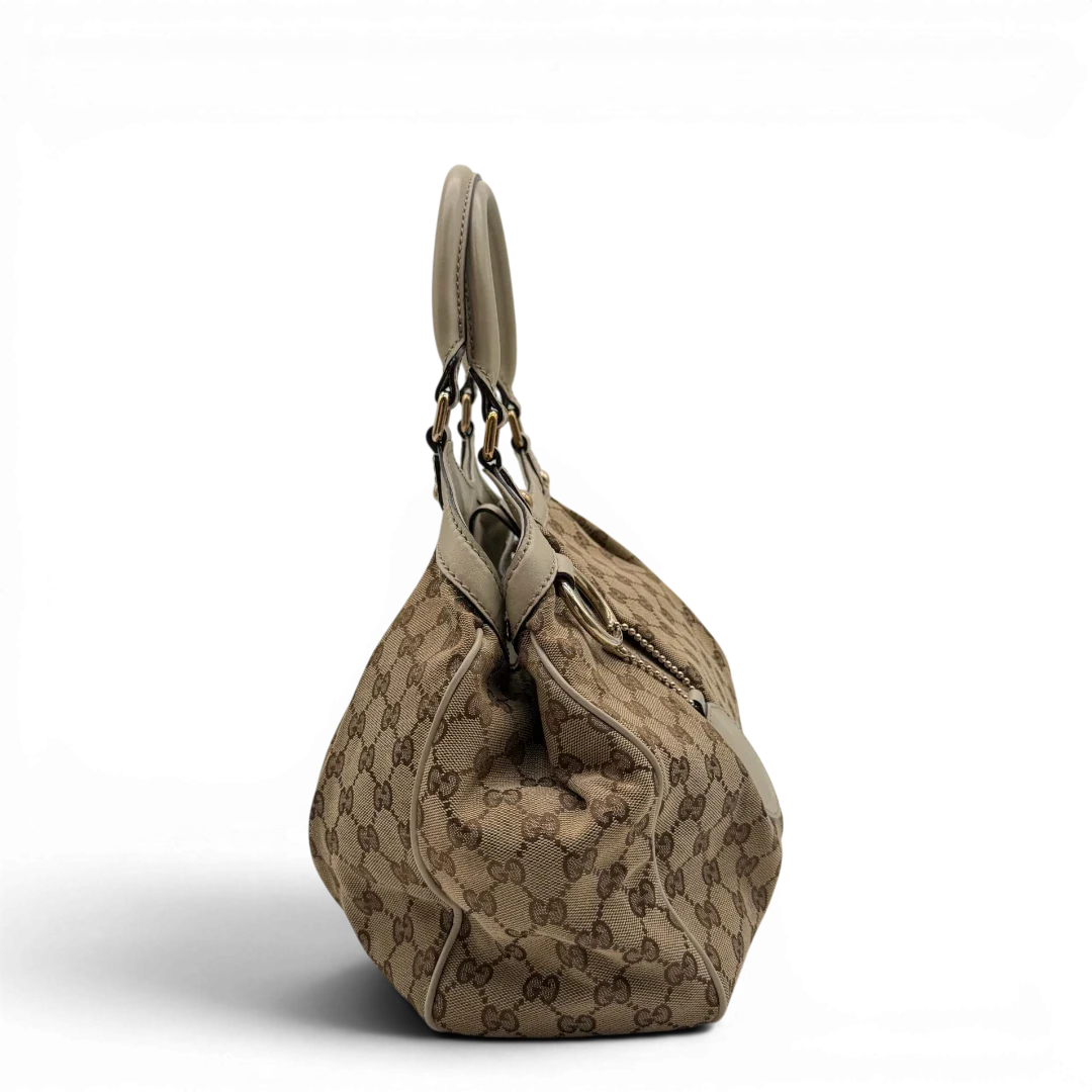 https://cdn.shopify.com/s/files/1/0564/9376/8855/files/Gucci_Shopper_Sukey_monogram_beige_vintage_GG8434.webp?v=1781108879