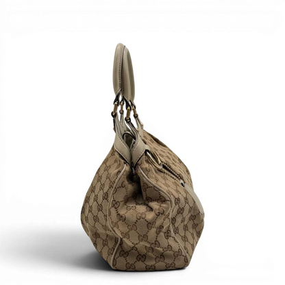 https://cdn.shopify.com/s/files/1/0564/9376/8855/files/Gucci_Shopper_Sukey_monogram_beige_vintage_GG8434.webp?v=1781108879