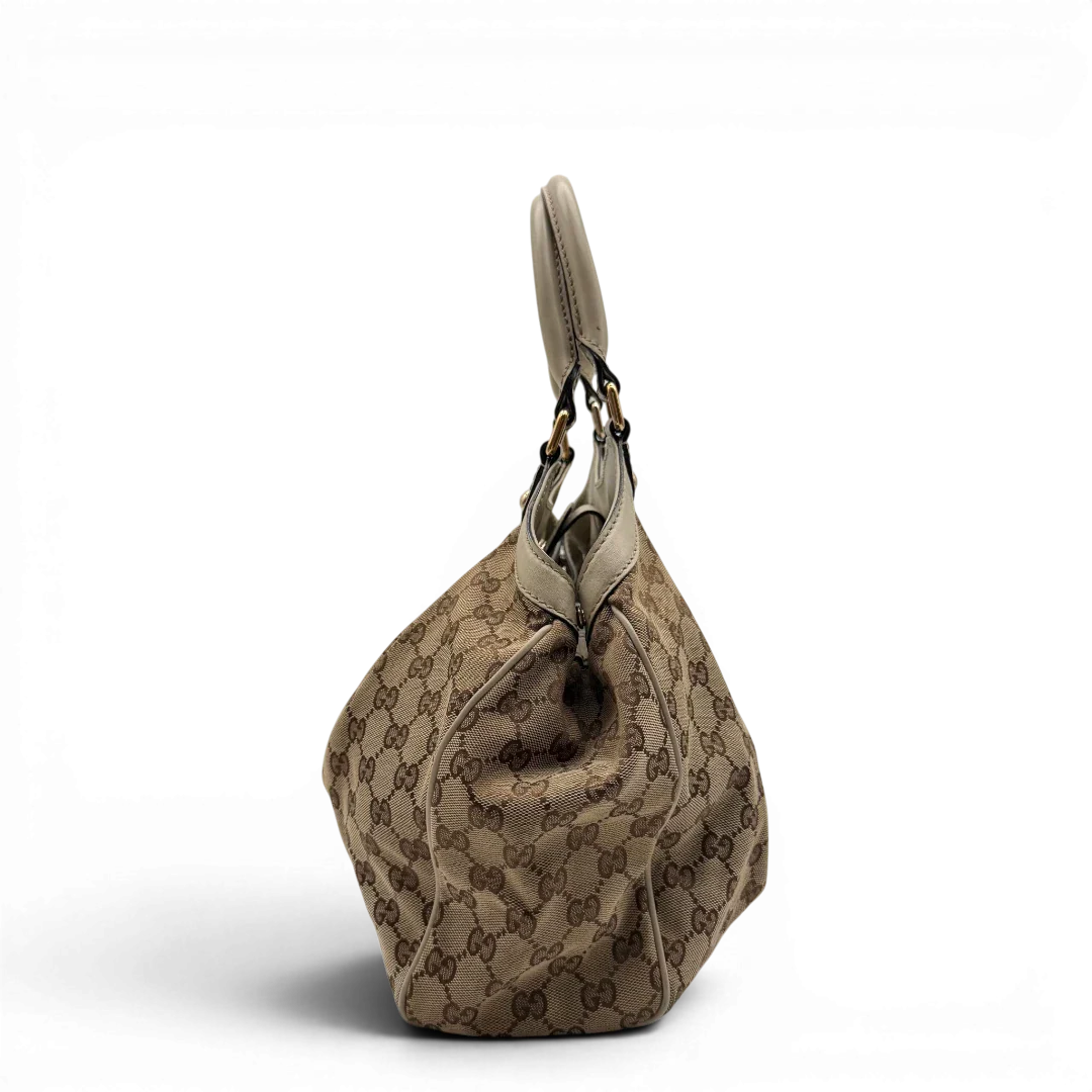 https://cdn.shopify.com/s/files/1/0564/9376/8855/files/Gucci_Shopper_Sukey_monogram_beige_vintage_GG8435.webp?v=1781108879