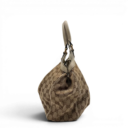https://cdn.shopify.com/s/files/1/0564/9376/8855/files/Gucci_Shopper_Sukey_monogram_beige_vintage_GG8435.webp?v=1781108879