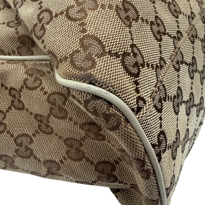 https://cdn.shopify.com/s/files/1/0564/9376/8855/files/Gucci_Shopper_Sukey_monogram_beige_vintage_GG8438.webp?v=1781108880