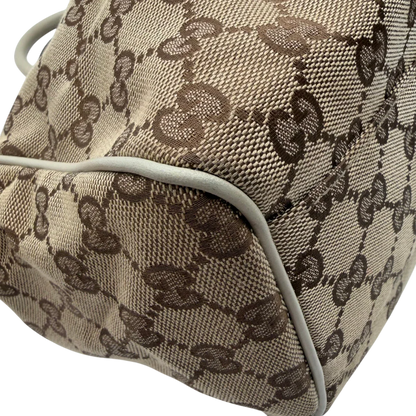 https://cdn.shopify.com/s/files/1/0564/9376/8855/files/Gucci_Shopper_Sukey_monogram_beige_vintage_GG8440.webp?v=1781108880