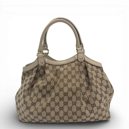 https://cdn.shopify.com/s/files/1/0564/9376/8855/files/Gucci_Shopper_Sukey_monogram_beige_vintage_GG_9856.webp?v=1770901535