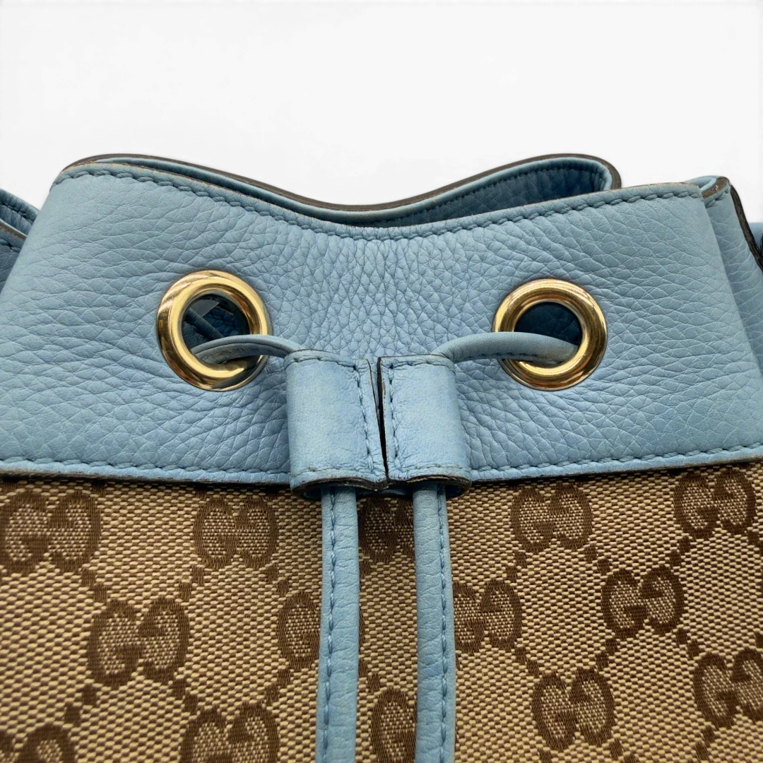 https://cdn.shopify.com/s/files/1/0564/9376/8855/files/Gucci_Umhangetasche_Bucket_monogram_beige_11.webp?v=1782385133