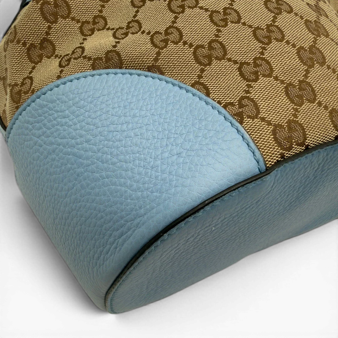 https://cdn.shopify.com/s/files/1/0564/9376/8855/files/Gucci_Umhangetasche_Bucket_monogram_beige_7.webp?v=1782385133