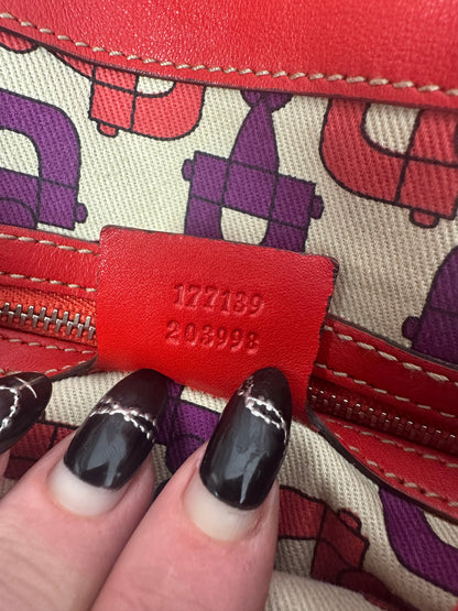 https://cdn.shopify.com/s/files/1/0900/2729/5066/files/Gucci_indy_bag_red_monogram_2007_Serial_Number.jpg?v=1776362149