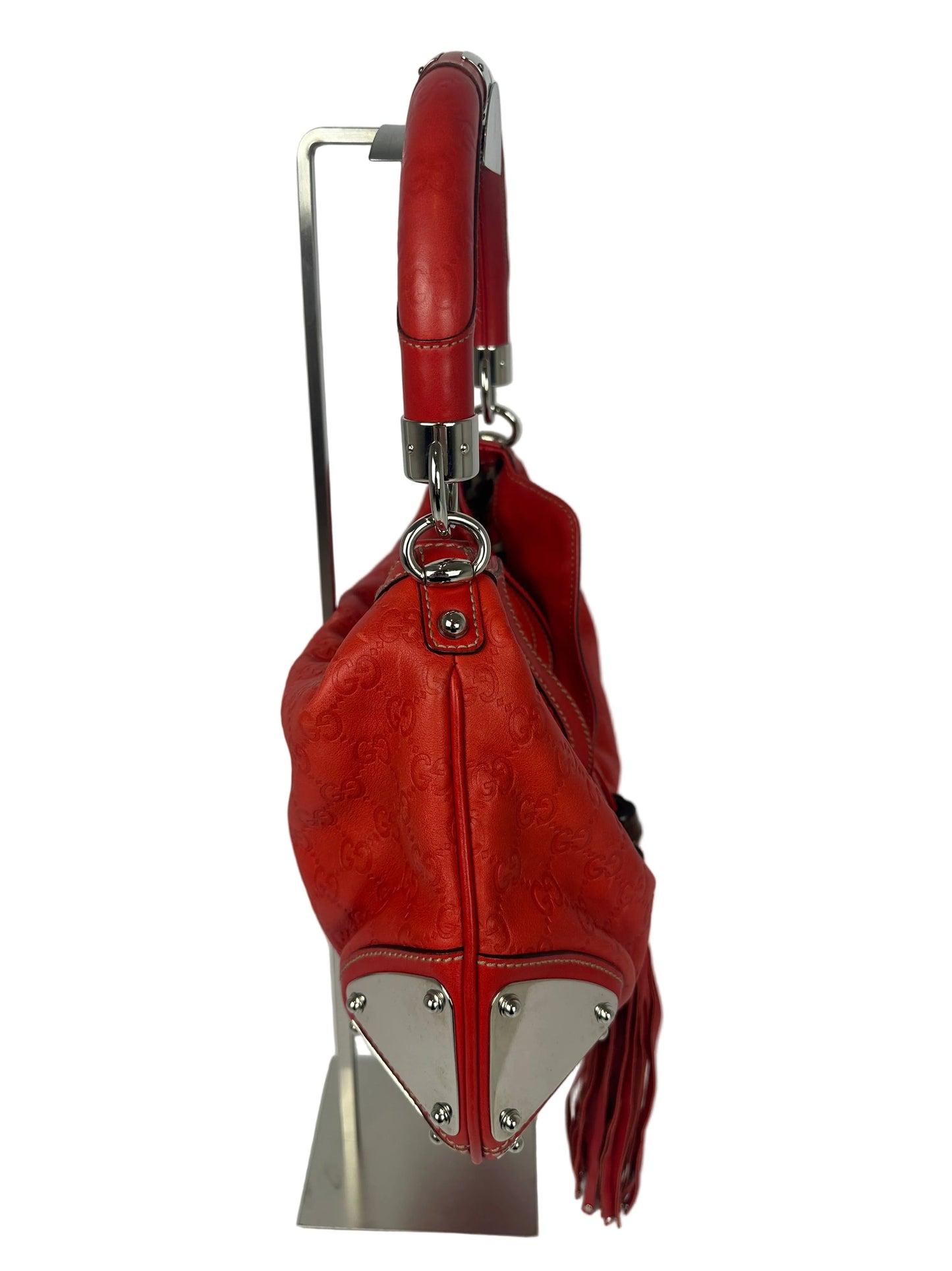 https://cdn.shopify.com/s/files/1/0900/2729/5066/files/Gucci_indy_bag_red_monogram_2007_Side.jpg?v=1776362149