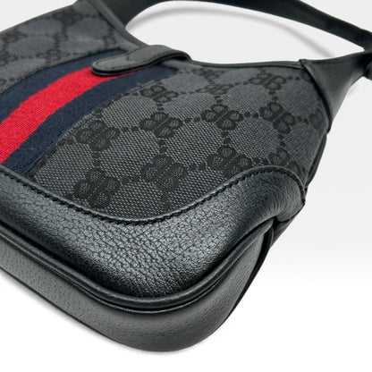 https://cdn.shopify.com/s/files/1/0564/9376/8855/files/Gucci_x_Balenciaga_Handtasche_Jackie_1961_mini_monogram_schwarz_vintage_GG_black_edition_handbag_9951.webp?v=1765456678
