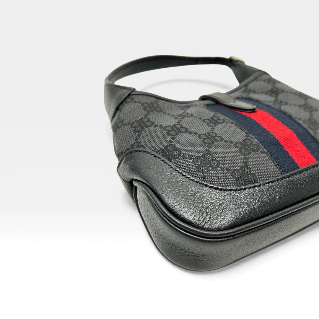 https://cdn.shopify.com/s/files/1/0564/9376/8855/files/Gucci_x_Balenciaga_Handtasche_Jackie_1961_mini_monogram_schwarz_vintage_GG_black_edition_handbag_9952.webp?v=1765456678