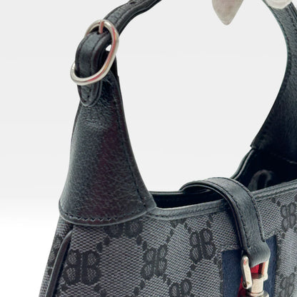 https://cdn.shopify.com/s/files/1/0564/9376/8855/files/Gucci_x_Balenciaga_Handtasche_Jackie_1961_mini_monogram_schwarz_vintage_GG_black_edition_handbag_9955.webp?v=1765456678